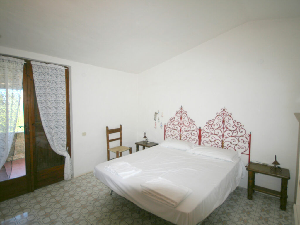 das zweite Schlafzimmer mit Doppelbett